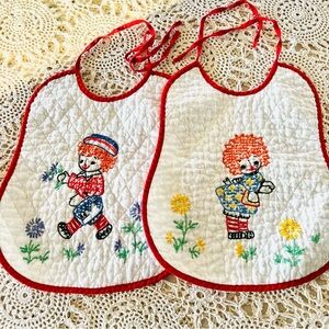 Vintage Raggedy Ann & Andy Two Handmade White Quilted w Needlepoint Red Ties Bib